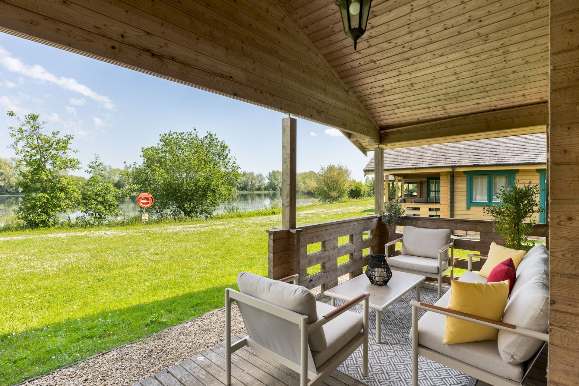 Covered decking at Primrose Lodge looking out over Lake Pochard
