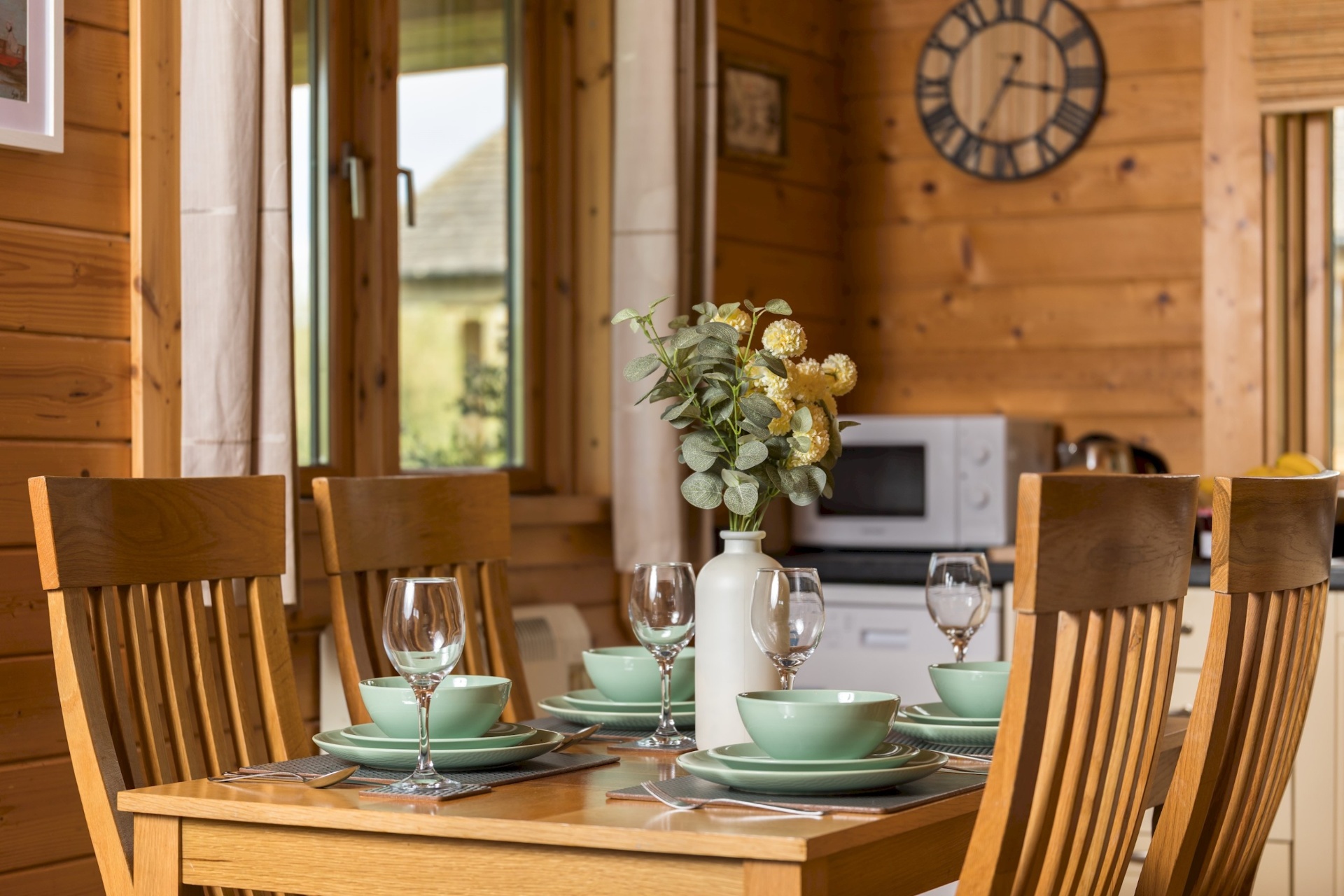 Dining table set for four inside Primrose Lodge