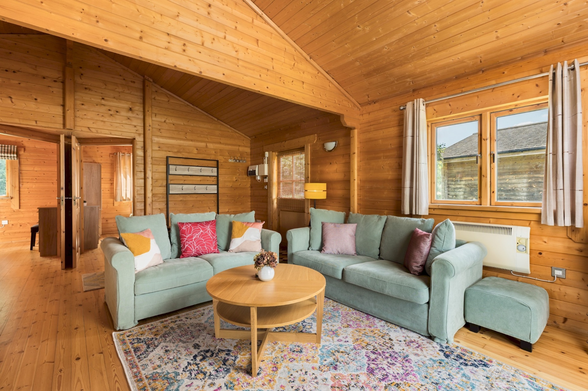 Lounge view towards the bedroom hallway at Primrose Lodge