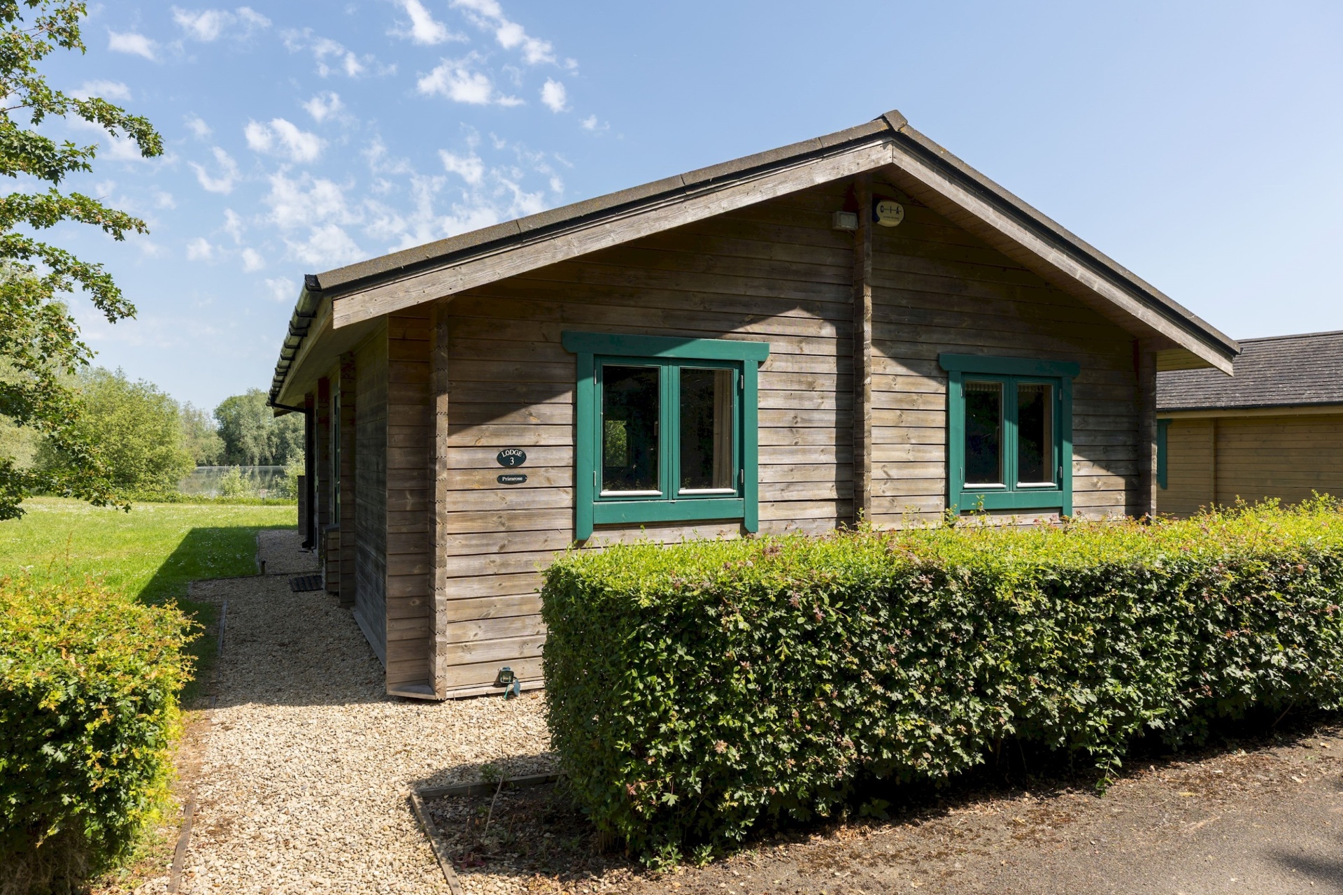 Side view of Primrose Lodge with lake in the background