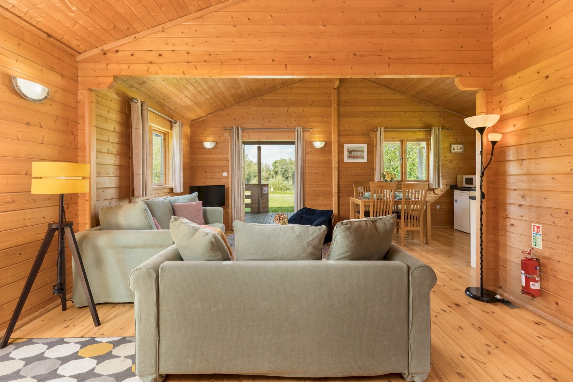 Open-plan lounge at Primrose Lodge looking towards the decking doors