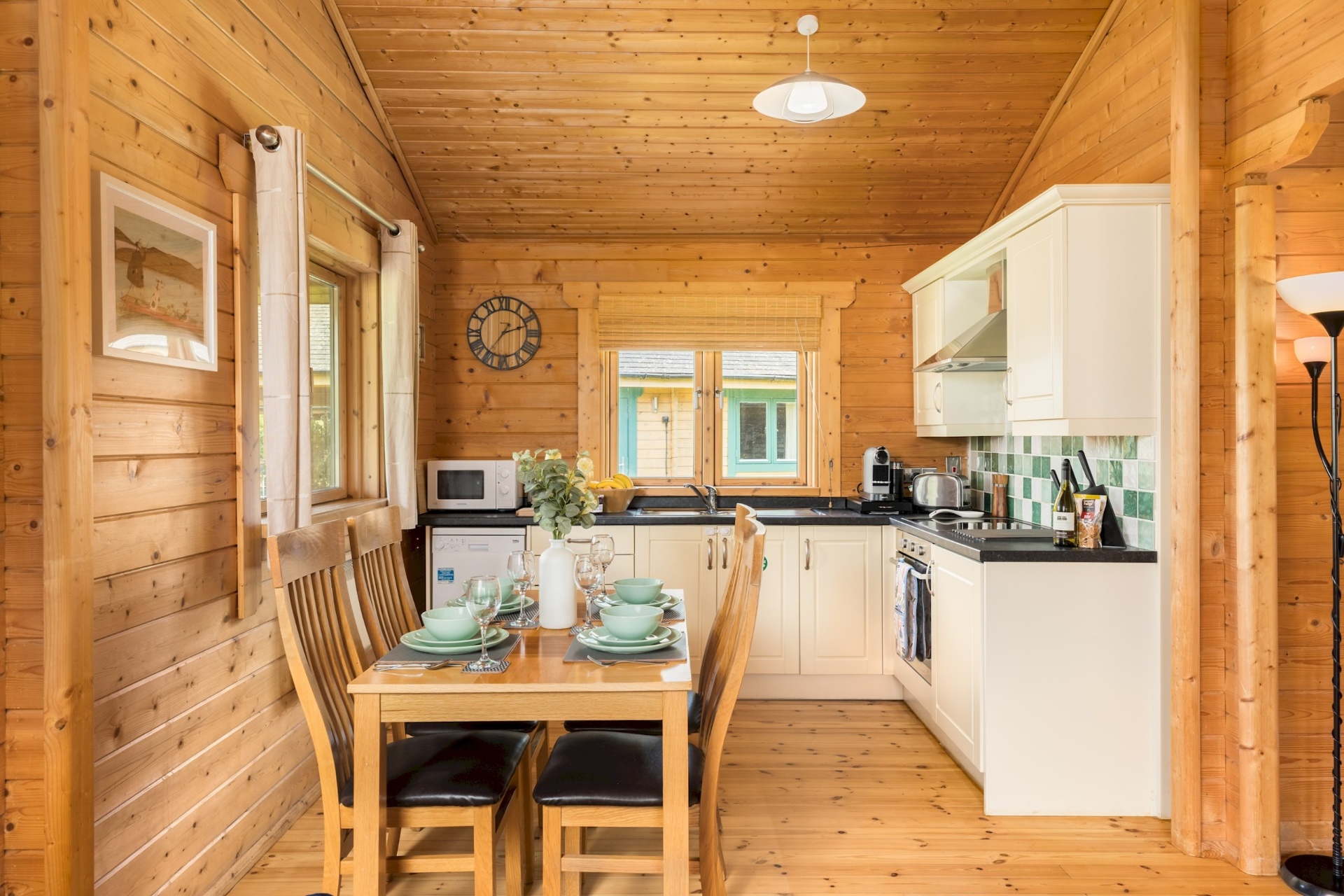 Kitchen and dining area at Primrose Lodge with table set for four