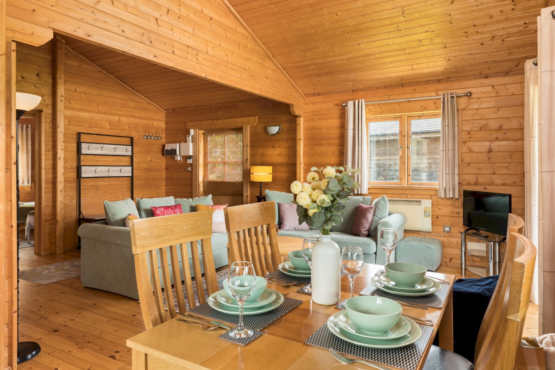Open-plan lounge and dining room at Primrose Lodge
