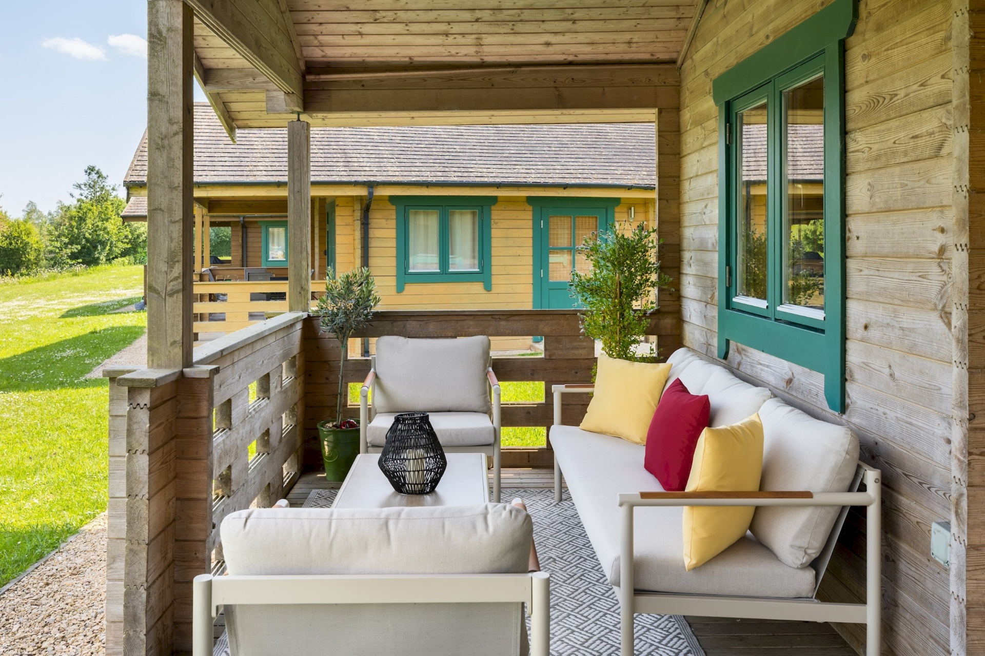 Veranda seating at Primrose Lodge looking towards a neighbouring lodge